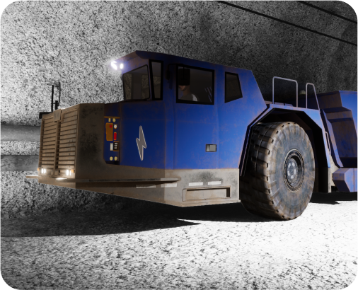 Blue heavy-duty mining vehicle with large tires and headlights, operating inside an underground tunnel.