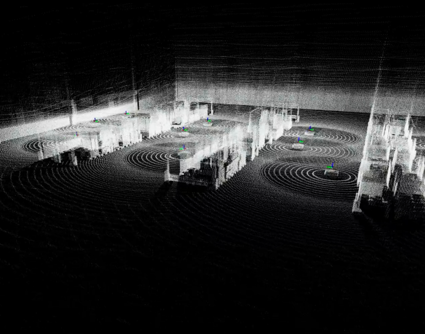 Simulated LiDAR point cloud of a warehouse with robot positions marked