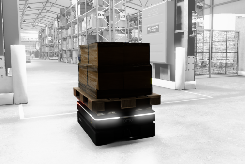 Autonomous mobile robot carrying a pallet through a simulated warehouse